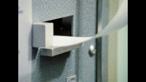 1970s: Receipt exits computer. Digital numbers change. Sensors and gauges. Man Video stock 125223632