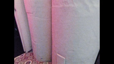 1970s: Receipt exits computer. Hot water heaters. Digital readouts change. Video stock 125223613