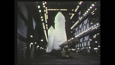 1970s: Skylab rescue rocket being assembled, prepared, and driven to launchpad, Vídeos de archivo 135843795