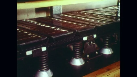 1970s: Solid chocolate bars are taken out of molds. Stock Footage 74921739