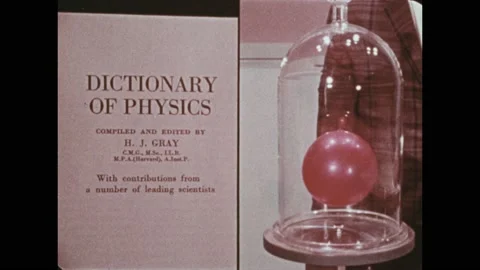 1970s: Split screen of the Dictionary of Physics and a balloon in a vacuum Stock Footage 189952179