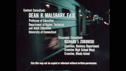 1970s: Train pulls into station. People board. Man sits, writes on lap. Office, Vidéo 228626121