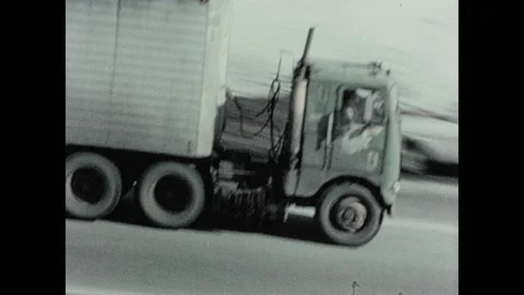 1970s: Truck and traffic move along highway.  Police chase.  Giant bird.  Stock Footage