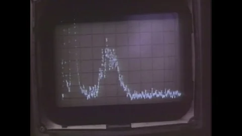 1970s: UNITED STATES: vortex on screen as pattern. Engineer records pattern of 库存影片 84615286