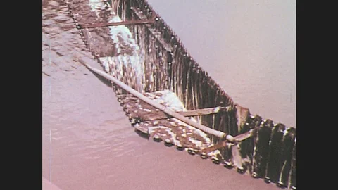 1970s: UNITED STATES: water filters through purification plant. Water in tanks. Stock Footage