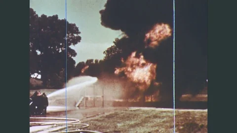 1970s: A vertical tank and a horizontal tank adjacent to each other outdoors are Stock Footage
