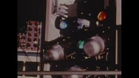 1970s: View of lights / Projector / Man at station in NASA control room / Close Stock Footage 74704741