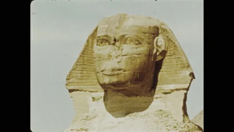 1970s: View of Sphinx. Man on camel, pyramid and Sphinx in background. Shots of Vidéo 155855368