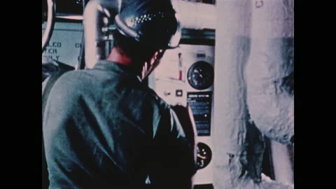 1970s: Worker opens control panel and closes door. Titan II missile launches Stock Footage 159169103