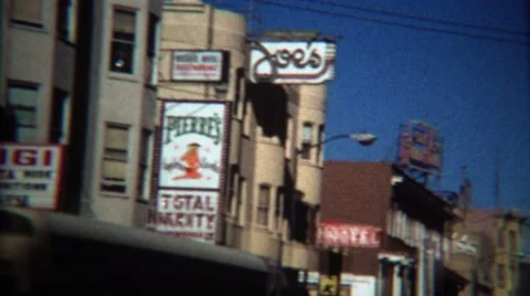 1971: Adult entertainment marquee signs at Columbus and Broadway. Stock Footage 59893574