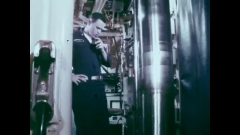 1971 - Crewmen utilize a centralized control system and a fire control computer Stock Footage 83640891
