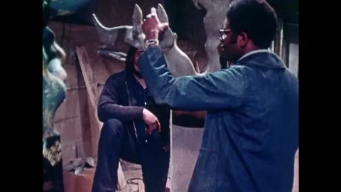1971 - A Harlem sculptor asks a man about getting his clay piece cast. Stock Footage 155853325