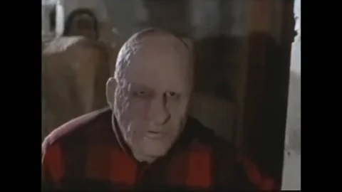 1971 - When the guard of her orphanage is attacked in the basement, a woman Stock Footage 129449808