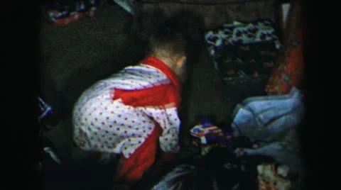 1972: little boy is playing with his christmas toys LYNBROOK, NEW YORK Stock Footage