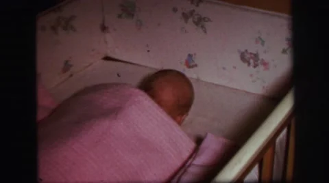 1972: newborn baby girl moving and trying to sleep on her cradle LYNBROOK Stock Footage