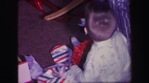1974: a child is seen opening gifts LYNBROOK, NEW YORK Stock Footage