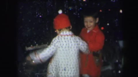 1974: children taking things from the floor of room with lot of mess LYNBROOK Stock Footage