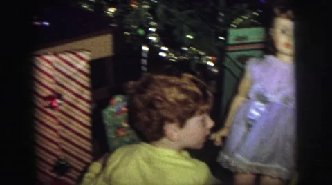 1974: christmas morning in the 1970s with two boys unwrapping presents LYNBROOK, Stock Footage