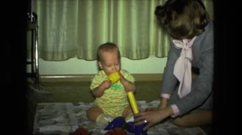 1974: mom is playing with her little son FORT WAYNE, INDIANA Stock Footage