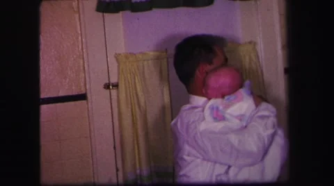 1974: a new addition to the house at feeding time. LYNBROOK, NEW YORK Stock Footage