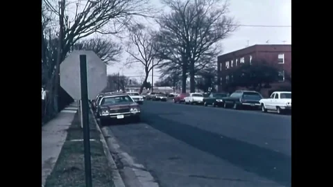 1974 - A policeman in a patrol car responds to a robbery and he shoots the Stock Footage