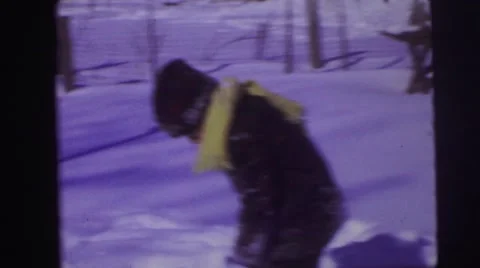 1974: two small boys shovel snow and play LYNBROOK, NEW YORK Stock Footage