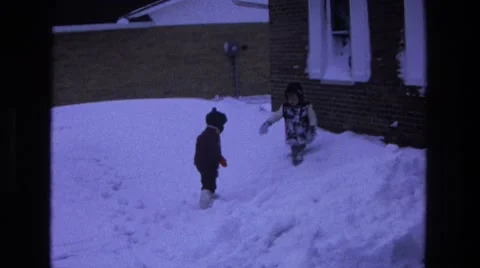 1975: kids walking in deep snow winter home CALIFORNIA Stock Footage