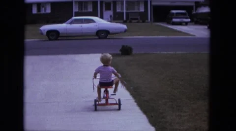 1975: toddlers is seen on cycle CALIFORNIA Stock Footage