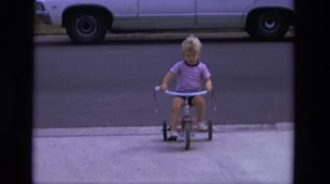 1975: toddlers is seen on cycle CALIFORNIA Stock Footage