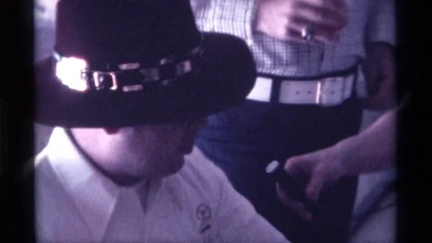 1976: Man in Hat Vigorously Responds to Interviewer Questions Stock Footage 73569011