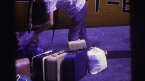 1979: Baggage Handler Loading Luggage Compartment of Airplane Video stock 67431704