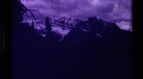 1979:CANADA.Dark Foreboding Shots Of Mountainous Terrain With A Cloudy Sky Stock Photos