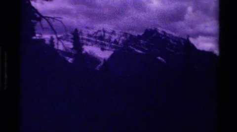 1979:CANADA.Dark Foreboding Shots Of Mountainous Terrain With A Cloudy Sky Stock Photos