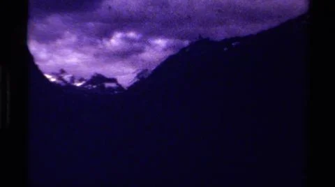 1979:CANADA.Dark Foreboding Shots Of Mountainous Terrain With A Cloudy Sky Stock Photos