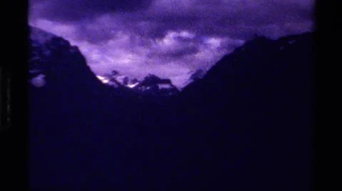 1979:CANADA.Dark Foreboding Shots Of Mountainous Terrain With A Cloudy Sky Stock Photos