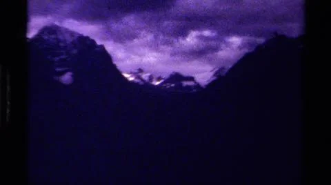 1979:CANADA.Dark Foreboding Shots Of Mountainous Terrain With A Cloudy Sky Stock Photos