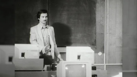1980s Computer Teacher Enters Class Teaches  Programing Code Vintage Film Movie Stock Footage 87287859