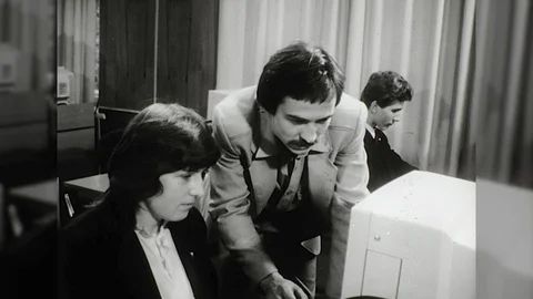 1980s Computer Teacher Teaches Young Woman Programing Code Vintage Film Movie Stock Footage 87298093