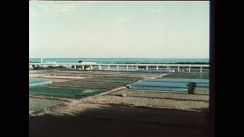 1980s: electric train on test track. NASA engineer works on copper design. Stock Footage 189951911