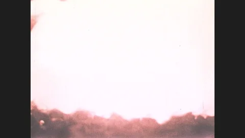 1980s: Hot gas explosion. Worker in a cave. Shale oil drains from rock. Stock Footage 87322057