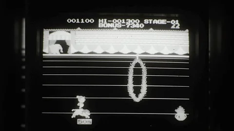 1980s Man Plays Old Fun Computer Game Screen Early Desktop PC Vintage Film Movie Vidéo 87304245