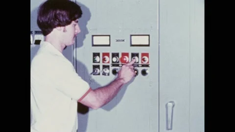 1980s: Man pushing buttons on control panel. Engine starting. Man testing Video stock 174731881