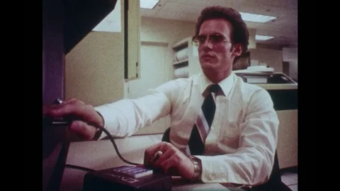 1980s: Man working at computer. Computerized drawing of car. Man at computer. Stock Footage 83129887