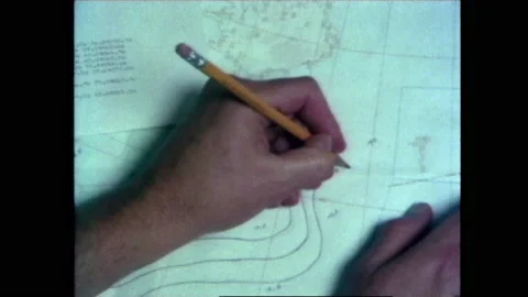 1980s: Person marks on geographical map. People in control room look at maps on Stock Footage 150344022