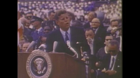 1980s: President John F. Kennedy gives a speech. Picture of Earth from the moon. Stock Footage
