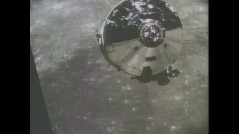 1980s: Satellite orbits earth. Space shuttle begins launch from launch pad. Stock Footage 84615492