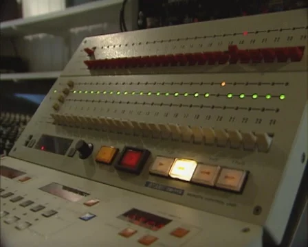1980s sound editor at work on a 24 tracks audio remote control 動画素材 47064409