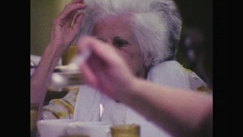 1980s: UNITED STATES: elderly ladies in care home. Man in wheelchair in Stock Footage