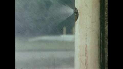 1980s: UNITED STATES: environmental testing of cars on track. Car drives along Stock Footage 85069559