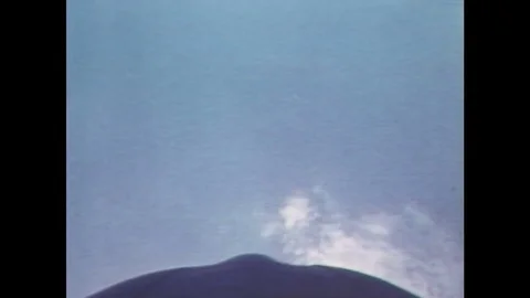 1980s: View from a plane flying in a loop. Wind blows across a sand dune. Wright Stockbeeldmateriaal 84904127